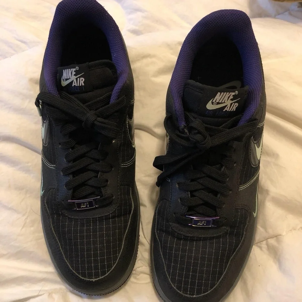 Nike Black and Purple Glow in the dark black AF1s Sneakers.